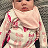 baby, infant, onesie, pink_bow, headband, bib, blanket, baby_clothing, cute, portrait, indoor, child, laying_down, soft_texture, pink, white, newborn, person, face, young_child