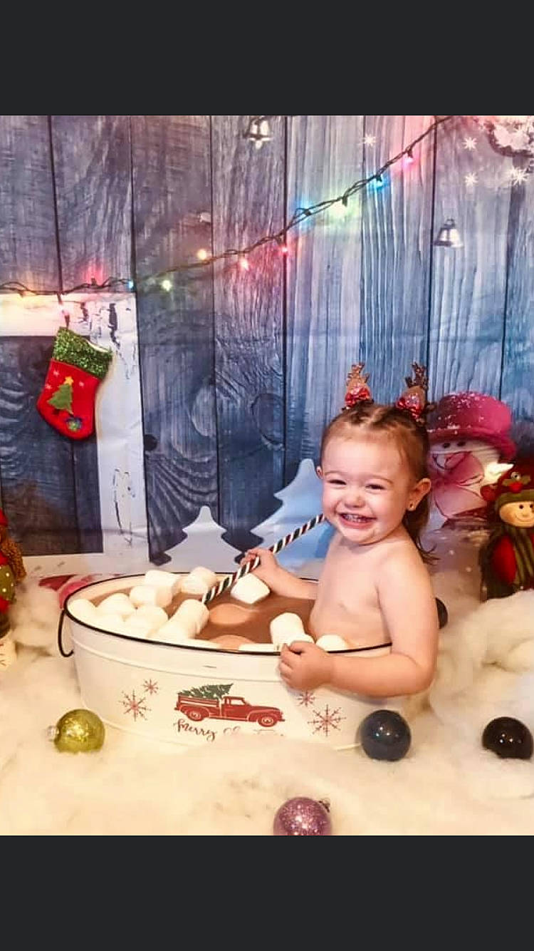 Hazel Lillian is registered to the contest to win money with this photo: baby, baby_grabbing_for_something, baby_laughing, baby_toddler_clothing, chest, child, christmas, christmas_decoration, christmas_eve, christmas_ornament, christmas_stocking, curtain, hair_accessory, holiday, interior_design, joy, ornament, person, platter, porcelain