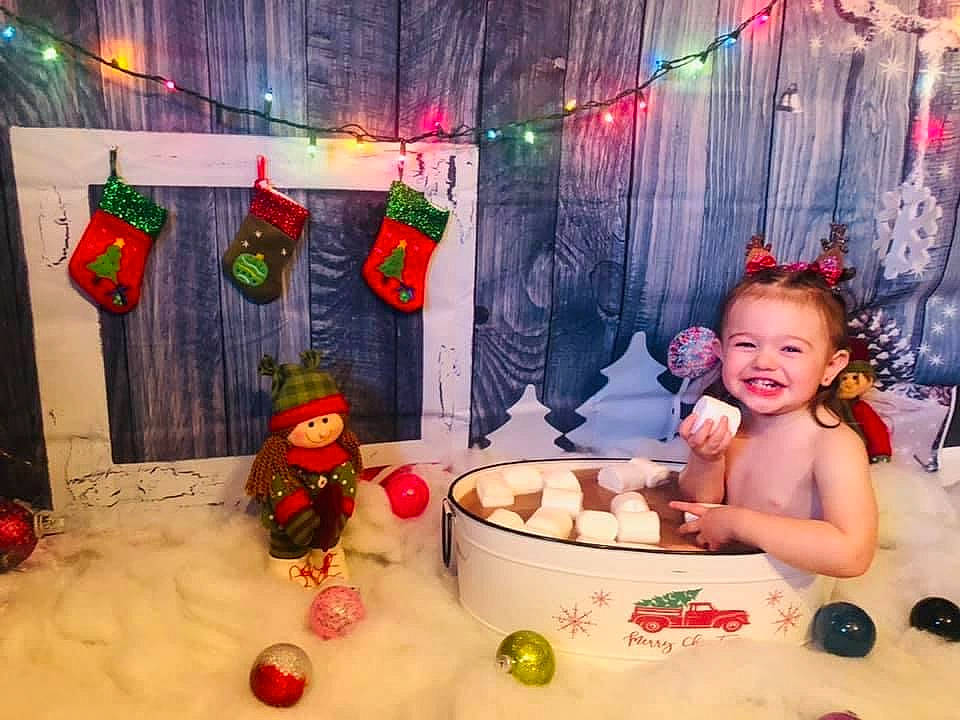Hazel Lillian joined the competition — help win amazing prizes! baby, baby_laughing, baby_toddler_clothing, bathing, child, christmas, christmas_decoration, christmas_eve, christmas_lights, christmas_stocking, decoration, fictional_character, hair_accessory, headpiece, holiday, interior_design, joy, ornament, person, swimwear