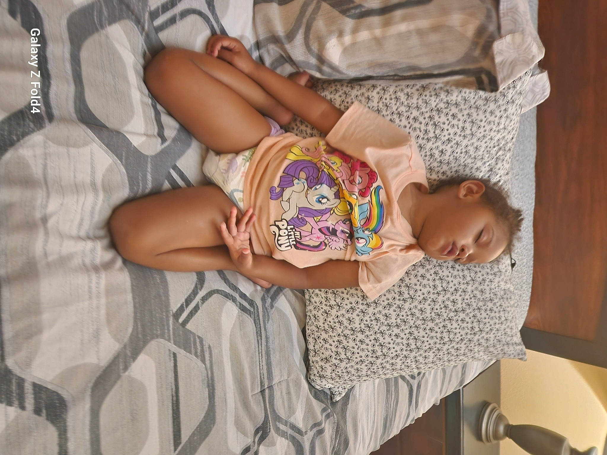 Melahdee is registered to the contest to win money with this photo: abdomen, baby, baby_products, chair, chest, child, comfort, couch, human_leg, jewellery, leisure, linens, nap, pattern, person, room, sitting, t_shirt, textile, thigh