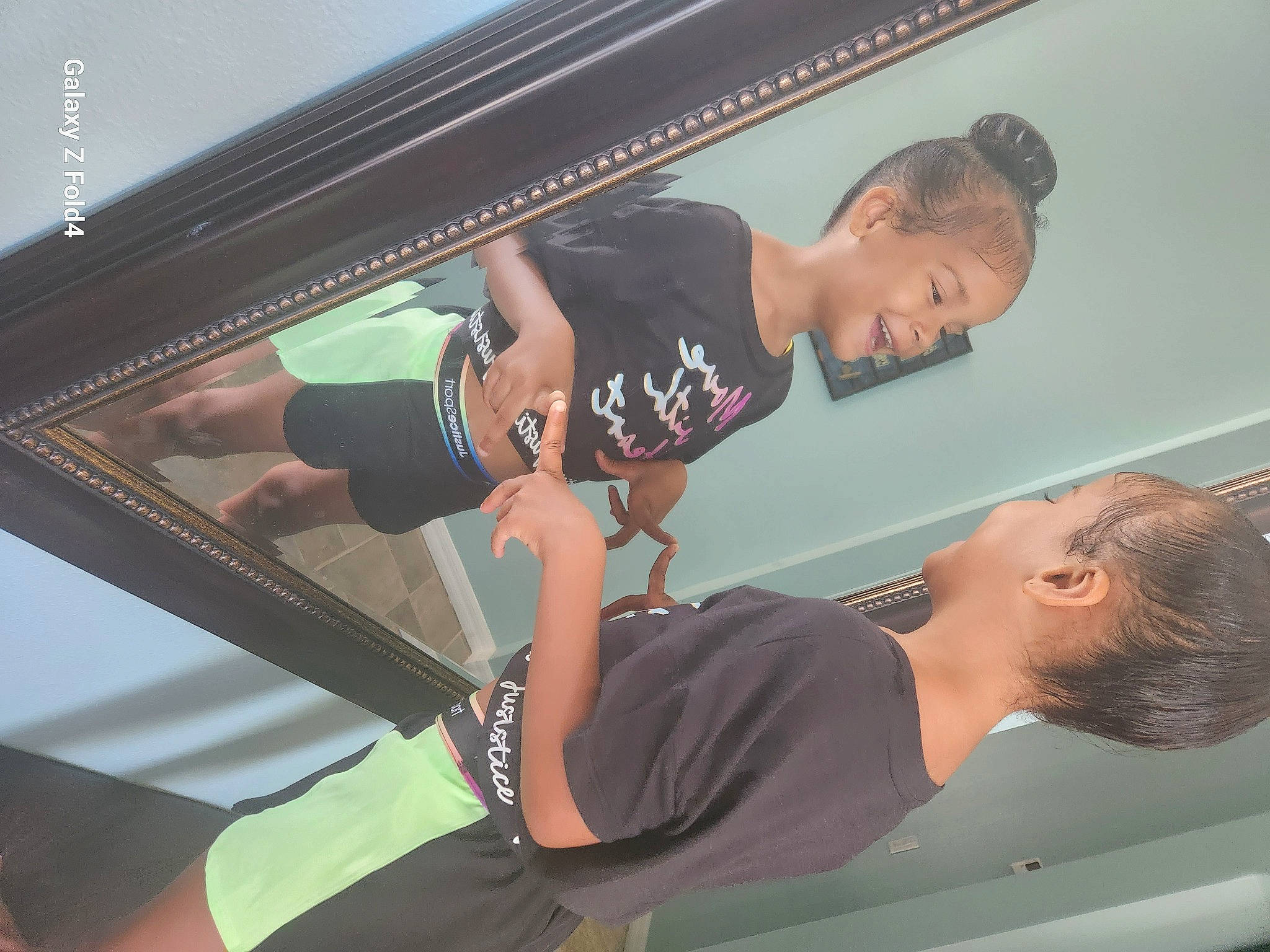 A'Mya is registered to the contest to win money with this photo: ceiling, chest, child, elbow, fun, human_leg, joint, joy, knee, leg, leisure, person, physical_fitness, recreation, room, shorts, shoulder, sportswear, t_shirt, thigh