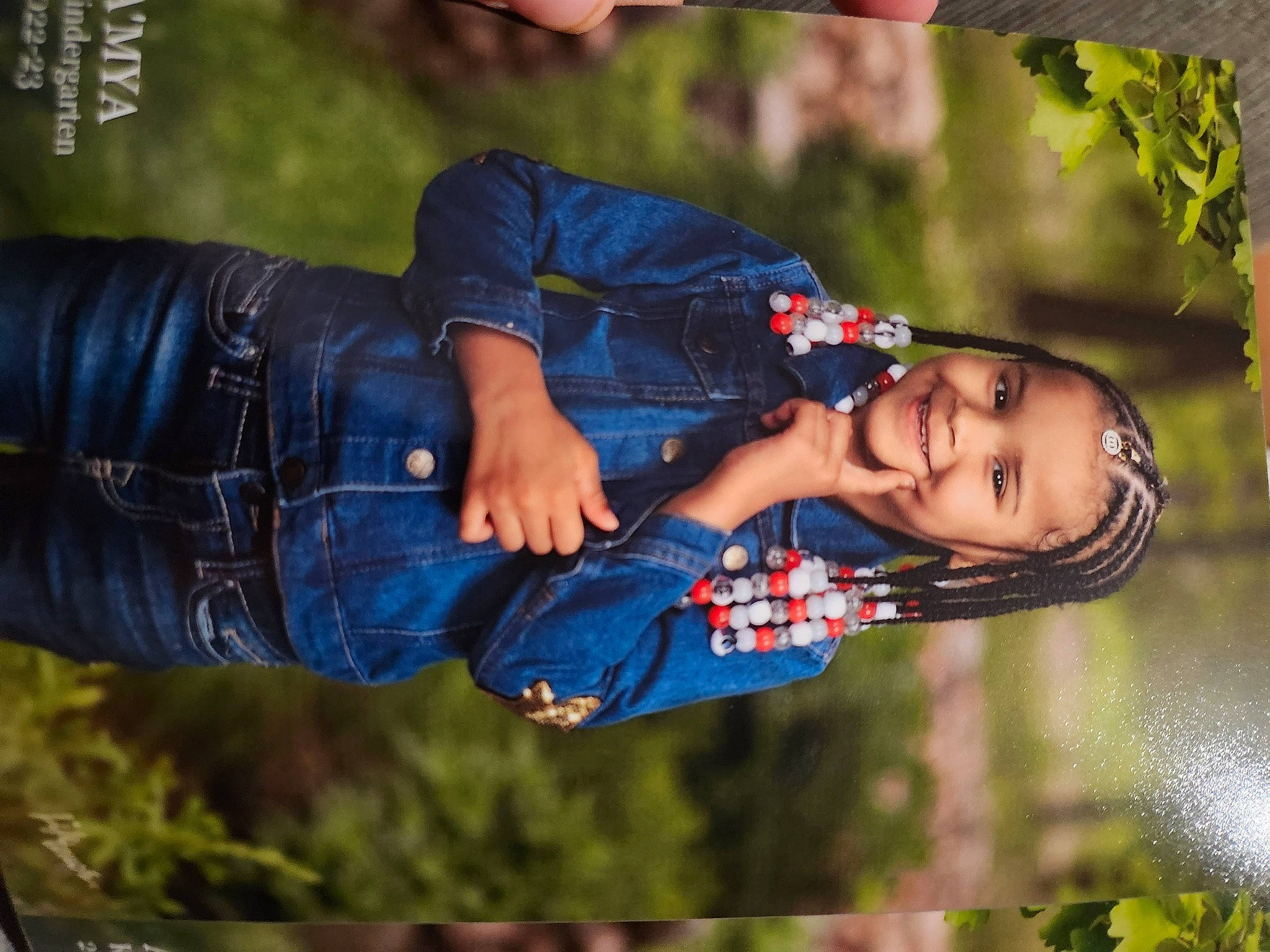 A'Mya is registered to the contest to win money with this photo: child, clothing, cool, denim, electric_blue, fashion, flash_photography, fun, gesture, grass, happy, joy, leisure, people_in_nature, person, plant, portrait_photography, recreation, sitting, toddler