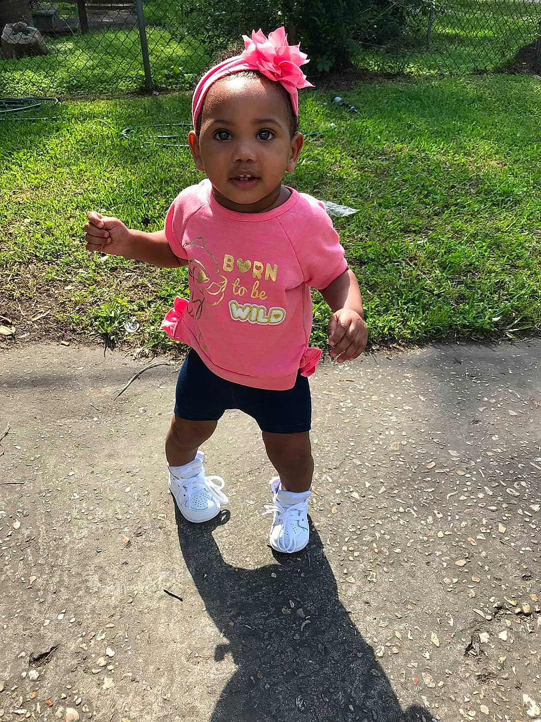 Jai'Lah is registered to the contest to win money with this photo: child, fun, hair_accessory, headband, leisure, person, pink, plant, play, recreation, smile, summer, toddler, vacation, walking