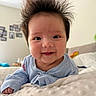 baby, bed, blanket, blue_clothing, child, couch, cute, face, furniture, hair, happy, head, home, indoor, infant, person, portrait, skin, smile, spiky_hair