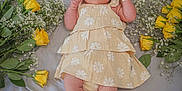 Kenza is registered to the contest to win money with this photo: baby, baby_breath, blanket, child, cute, flower_arrangement, flowers, hat, infant, lying_down, nature, outdoor_style, peaceful, person, portrait, skin, soft_lighting, summer, yellow_dress, yellow_roses