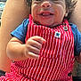 Jayton joined the competition — help win amazing prizes! baby, car_interior, child, closeup, clothing, curly_hair, cute, face, hand, happy, indoor, infant, person, portrait, red_overall, seat, skin, smiling, striped_clothing, young_child