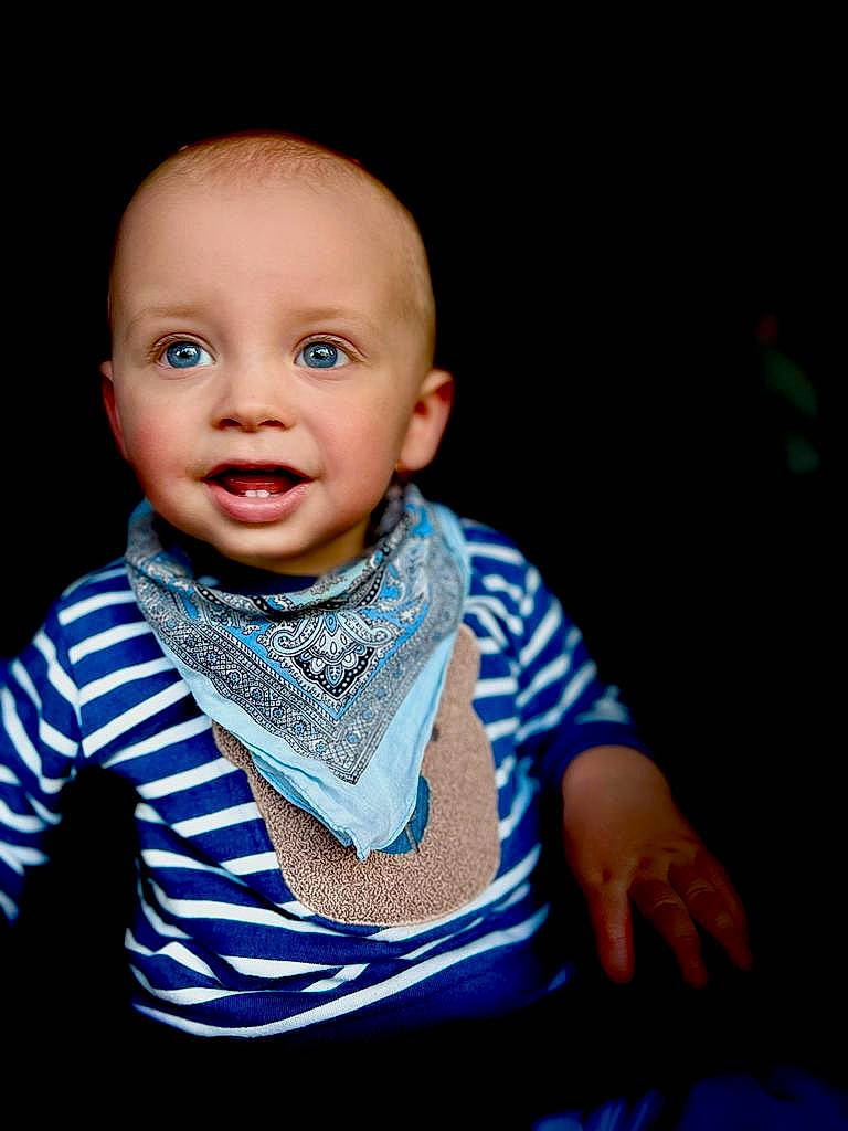 Caspian joined the competition — help win amazing prizes! baby, baby_toddler_clothing, cheek, child, chin, collar, electric_blue, fashion_accessory, flash_photography, fun, happy, iris, pattern, person, portrait_photography, sitting, skin, sleeve, smile, t_shirt