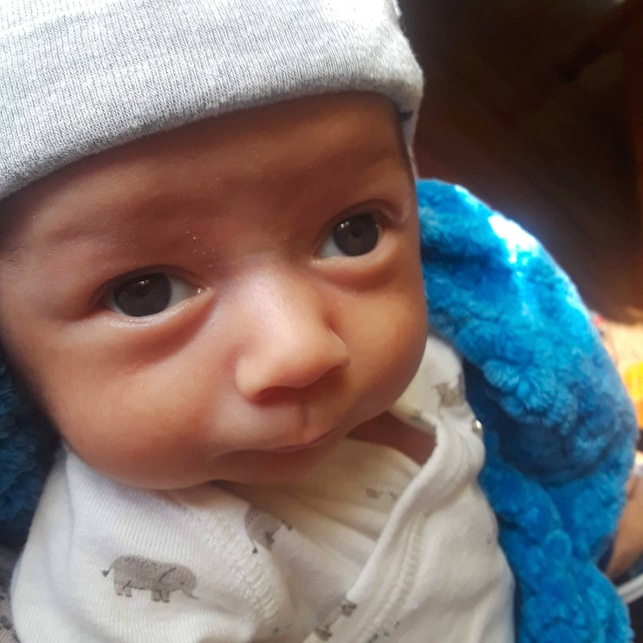 Johnathon is registered to the contest to win money with this photo: baby, bonnet, cap, cheek, child, cool, eye, eyebrow, face, forehead, hat, head, headgear, headwear, knit_cap, lip, nose, person, skin, smile