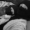 adult, balaclava, black_and_white, blanket, casual, child, closeup, cozy, eyes, fabric, face_covering, headwear, indoor, parent_and_child, person, portrait, resting, soft_texture, two_people, warm