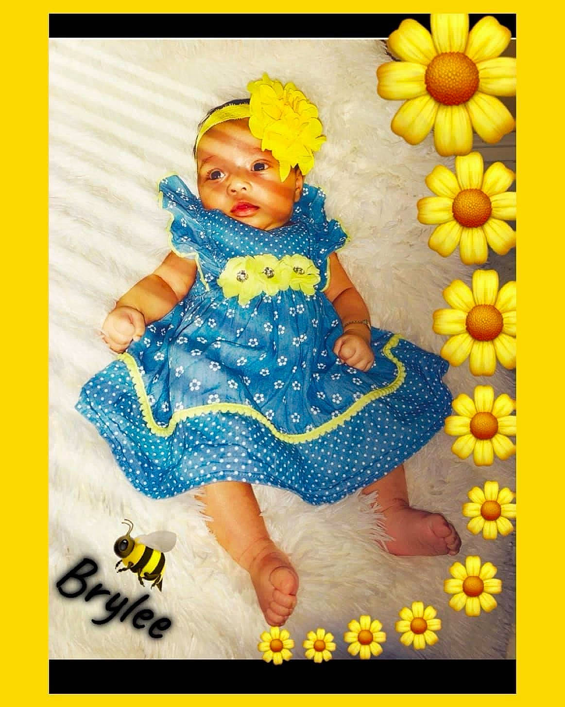 Brylee joined the competition — help win amazing prizes! art, baby, baby_toddler_clothing, child, electric_blue, flower, font, happy, magenta, pattern, person, petal, plant, rectangle, rose, sitting, sleeve, sunflower, textile, toddler
