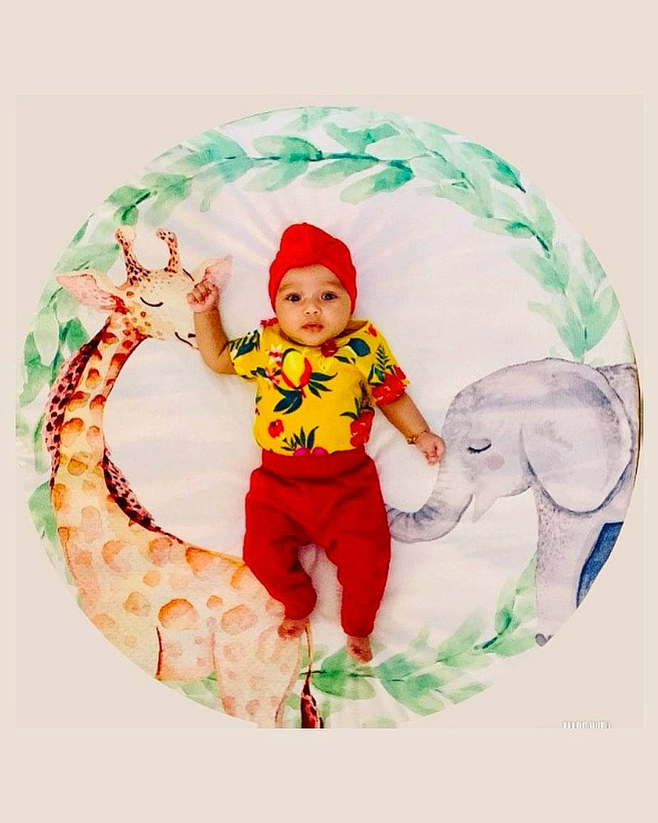 Brylee joined the competition — help win amazing prizes! baby, baby_toddler_clothing, child, christmas, christmas_eve, circle, costume_hat, event, fictional_character, font, graphics, happy, hat, headwear, holiday_ornament, pattern, person, sleeve, smile, t_shirt