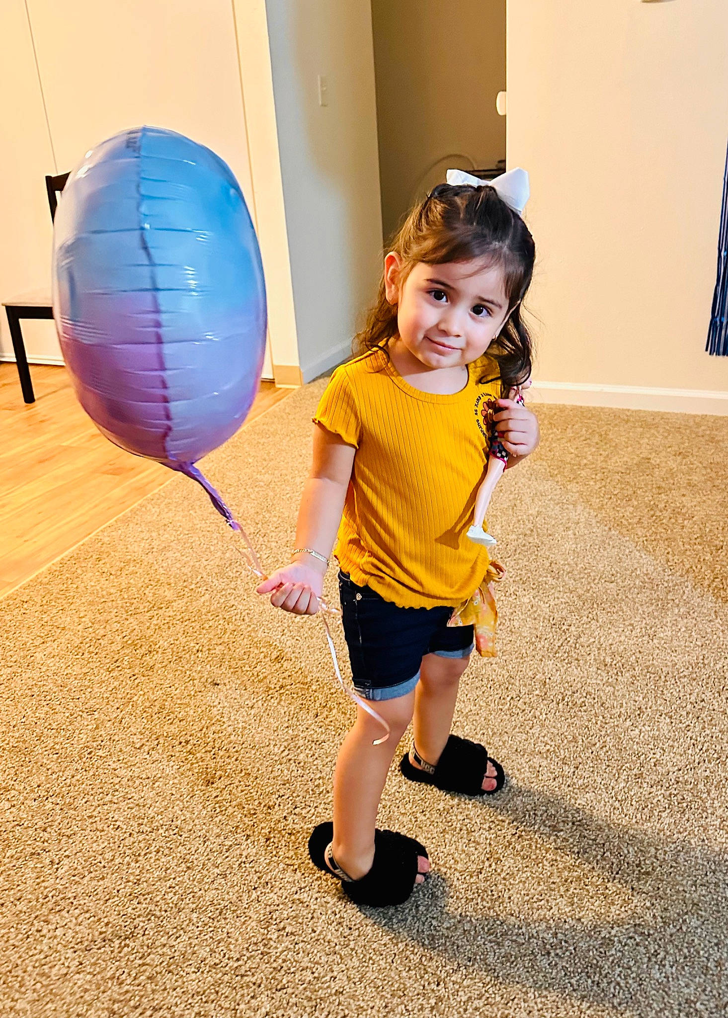 Ariana joined the competition — help win amazing prizes! balloon, beauty, child, electric_blue, flag, floor, flooring, fun, happy, human_body, human_leg, joy, leg, leisure, magenta, person, pink, recreation, sandal, standing