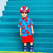 Yasir joined the competition — help win amazing prizes! child, boy, toddler, spiderman, superhero, helmet, costume, blue_shirt, red_shorts, sneakers, standing, smiling, portrait, outdoor, stairs, steps, turquoise, colorful, fashion, playful