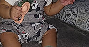 Benjamin joined the competition — help win amazing prizes! baby, child, sitting, sofa, couch, toy, spoon, smiling, portrait, indoors, clothing, overalls, socks, green_socks, flash_photography, home, furniture, infant, playful, patterned_clothing