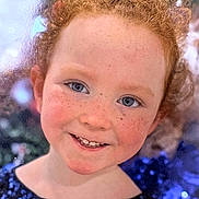 Kathy a rejoint le concours — aidez-le/la à gagner de superbes lots ! child, red_hair, freckles, blue_eyes, smile, portrait, face, curly_hair, sequins, clothing, young, happy, closeup, person, cute, fashion, sparkle, natural_light, background, joy