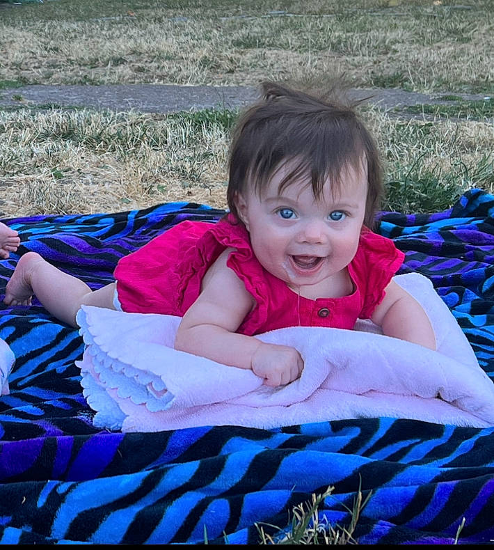 Scarlett joined the competition — help win amazing prizes! baby, baby_products, baby_toddler_clothing, blue, child, electric_blue, event, fun, grass, happy, iris, joy, leisure, magenta, people_in_nature, person, pink, purple, recreation, sitting