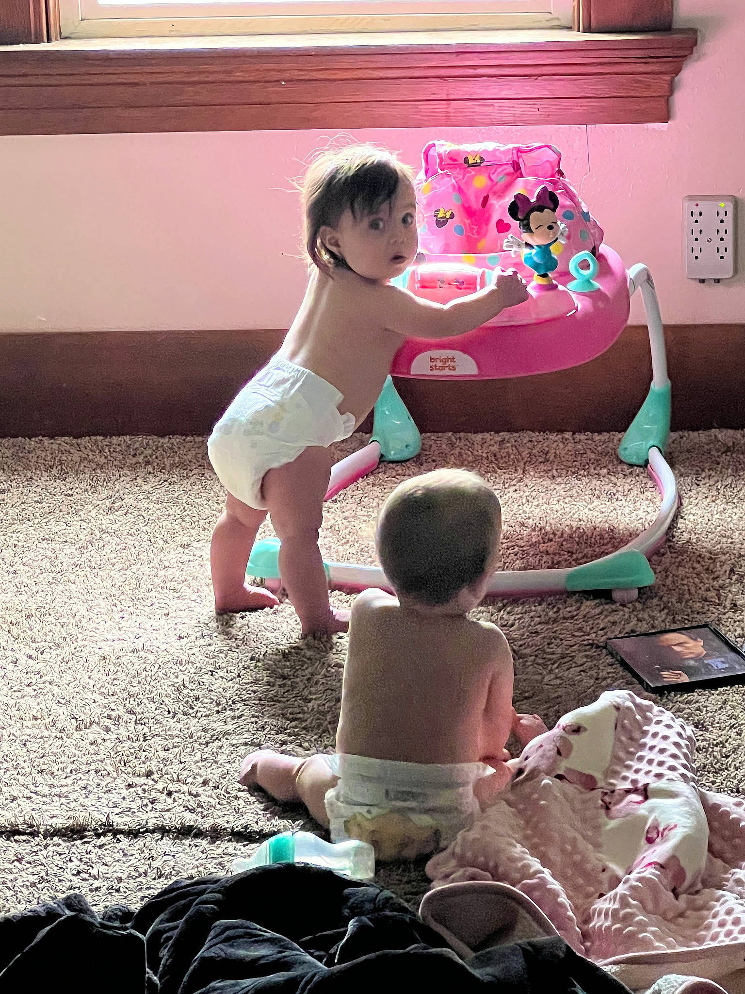 Scarlet is registered to the contest to win money with this photo: baby, baby_toddler_clothing, child, flooring, foot, fun, happy, human_body, human_leg, leisure, magenta, pattern, person, pink, play, sandal, sitting, sock, surprise, thigh