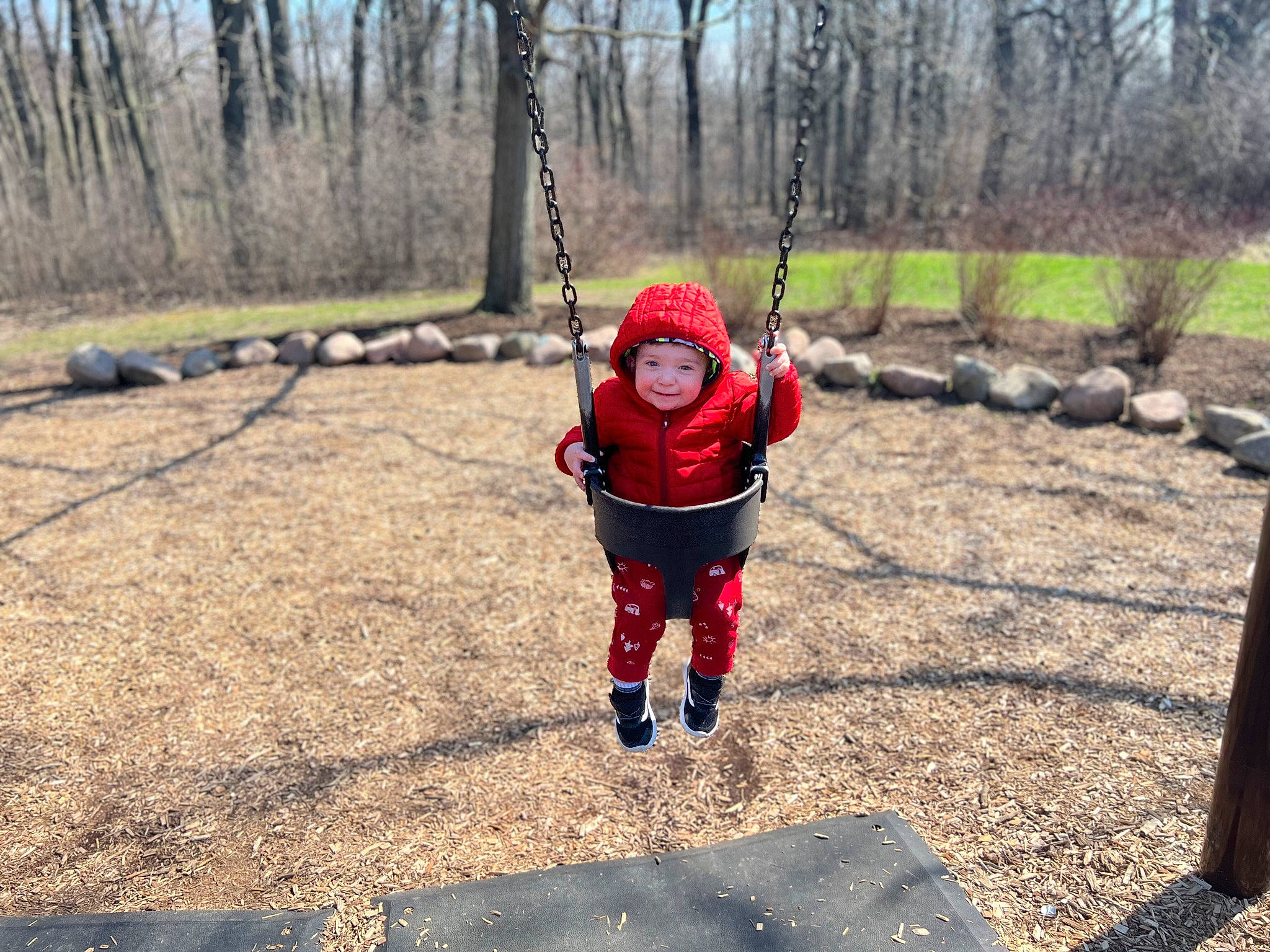 Mahdi joined the competition — help win amazing prizes! baby, child, fun, grass, headwear, jacket, joy, landscape, leisure, outdoor_play_equipment, people_in_nature, person, plant, play, recreation, soil, swing, toddler, tree, windbreaker