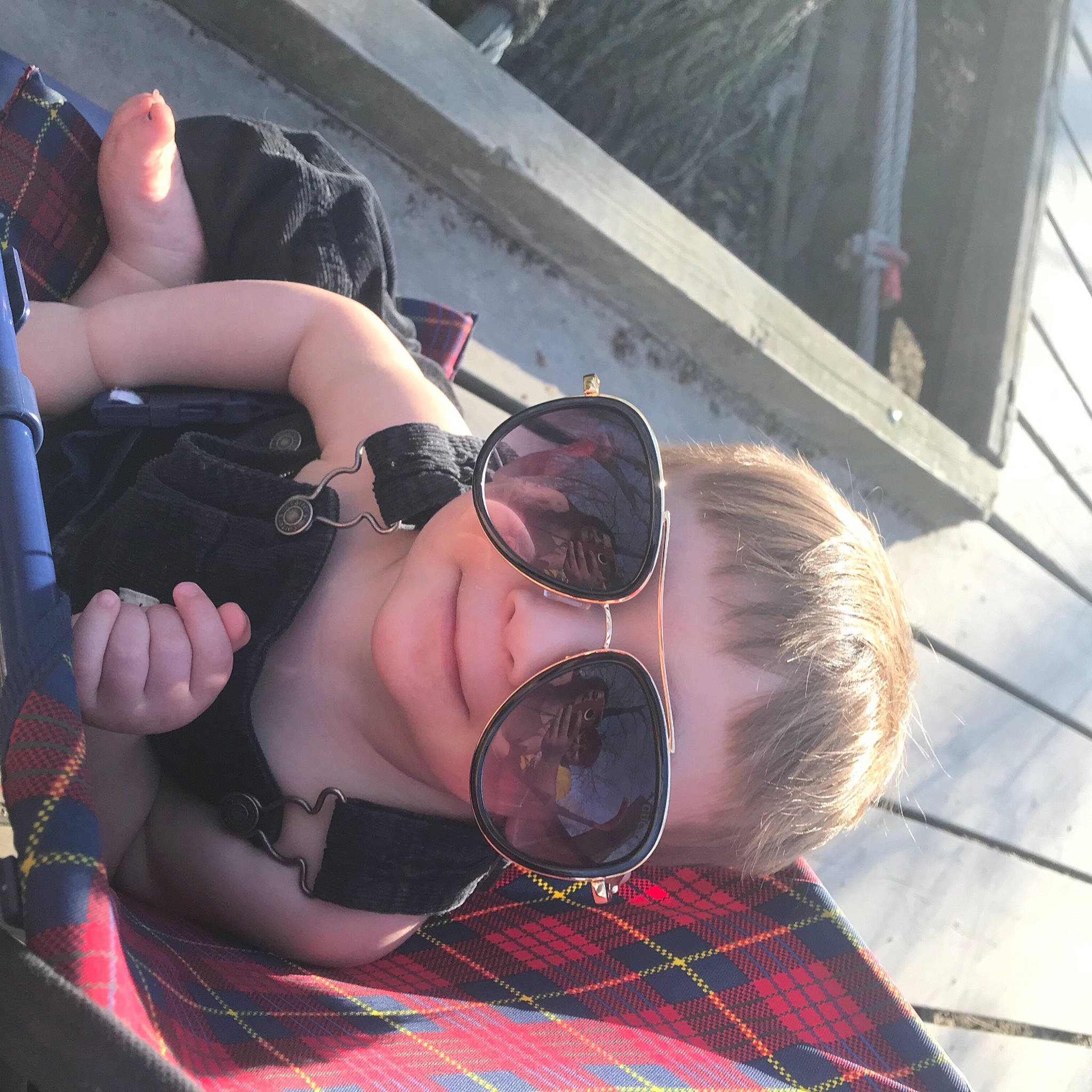 Mahdi is registered to the contest to win money with this photo: black, black_hair, chest, comfort, cool, eyewear, foot, fun, glasses, goggles, human_leg, leisure, mouth, pattern, person, personal_protective_equipment, plaid, sunglasses, tartan, thigh
