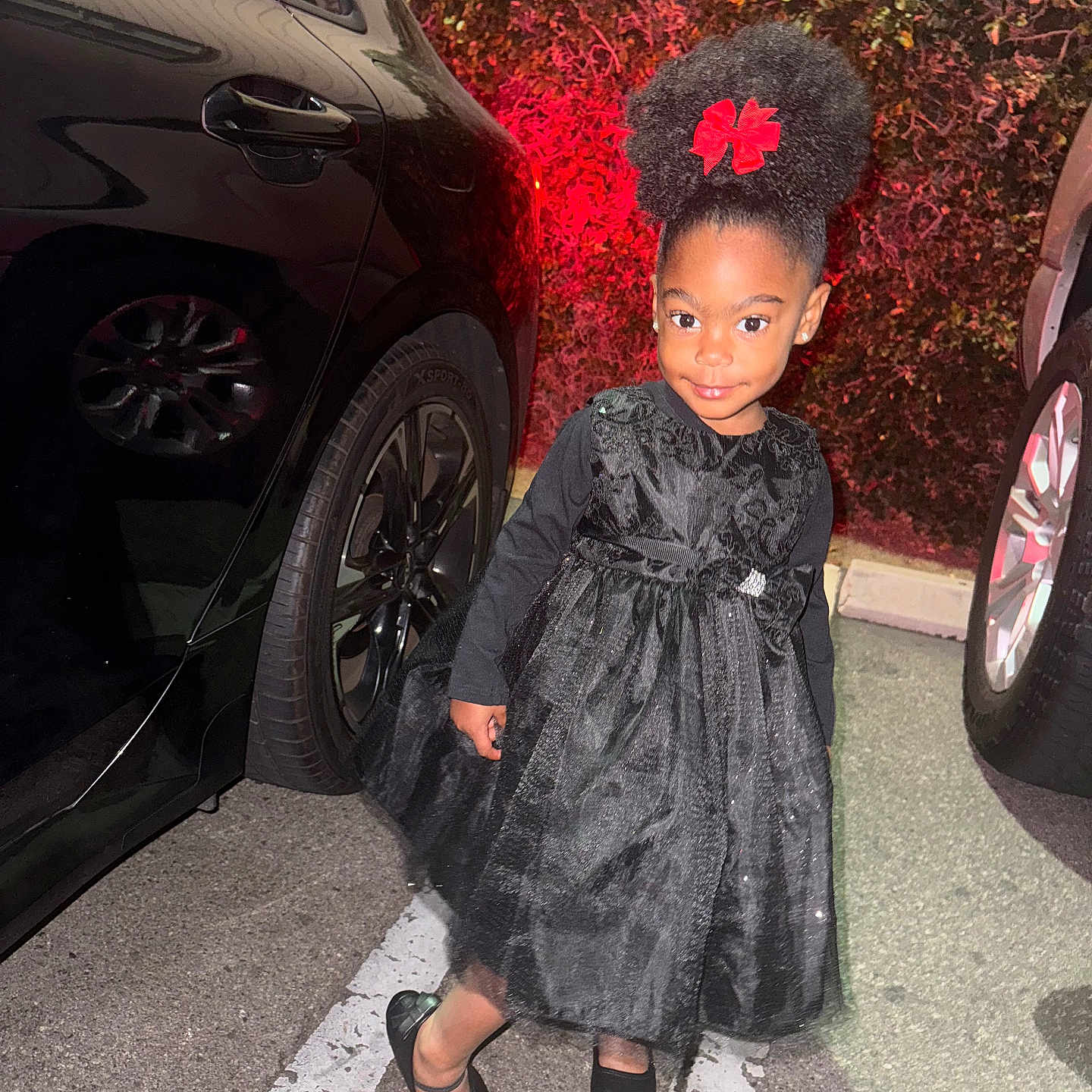 Kaliyah is registered to the contest to win money with this photo: alloywheel, car, carwheel, child, clothing, coat, dress, face, female, girl, head, machine, person, photography, portrait, spoke, tire, transportation, vehicle, wheel