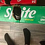 Snooki joined the competition — help win amazing prizes! animal, beverage_box, black_and_white_cat, box, cardboard, cardboard_box, cat, coca_cola, curious, feet, floor, hole, household, indoors, peeking, pets, socks, sprite, stacked_boxes, wooden_floor