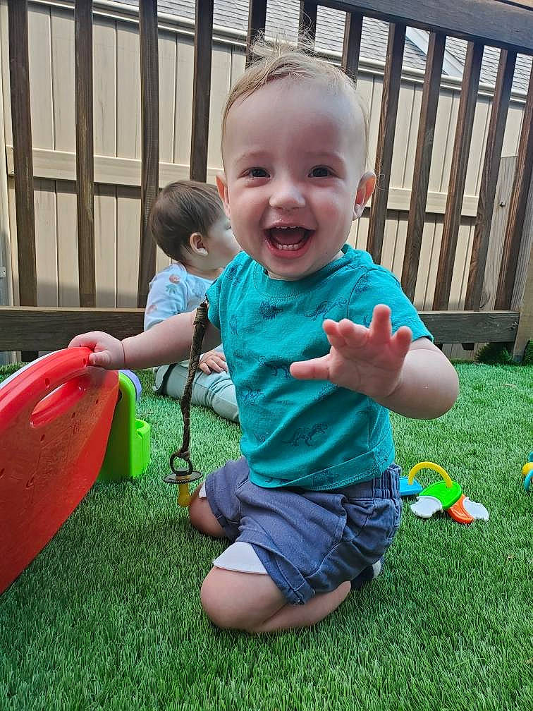Calvin joined the competition — help win amazing prizes! baby, baby_toddler_clothing, child, fun, garden, grass, happy, joy, lawn, leaf, leisure, people_in_nature, person, play, recreation, shorts, sitting, smile, spring, summer