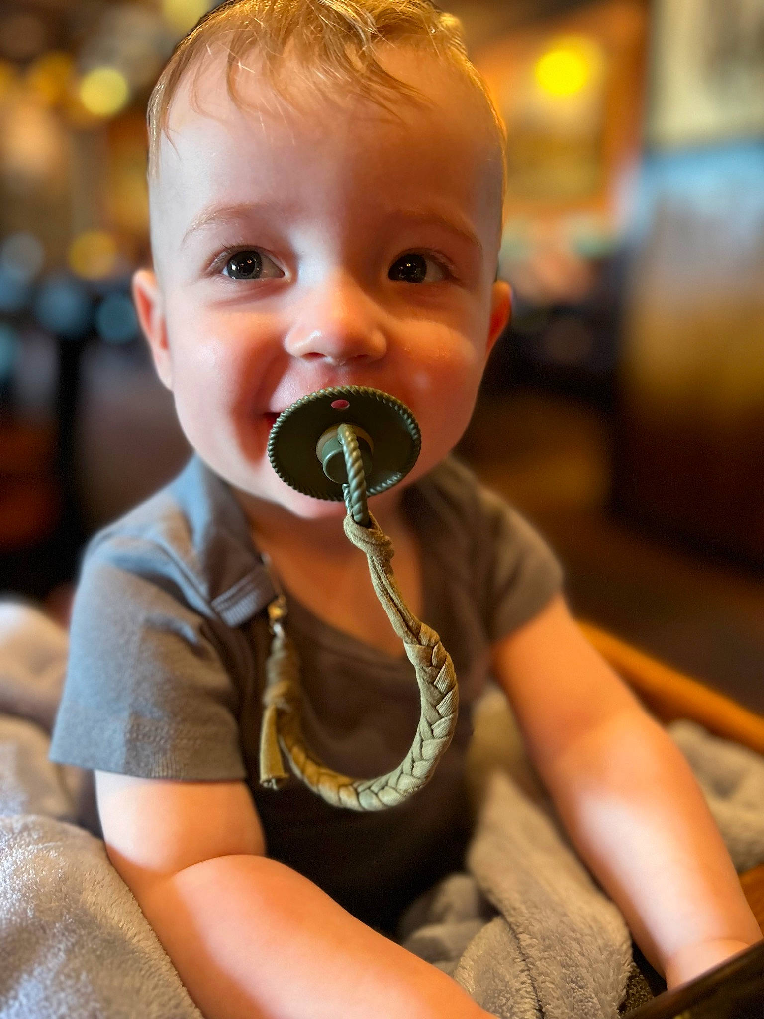 Calvin is registered to the contest to win money with this photo: audio_equipment, baby, cheek, child, chin, comfort, eye, eyelash, eyewear, fun, grass, happy, head, iris, leisure, lip, nose, person, sitting, smile