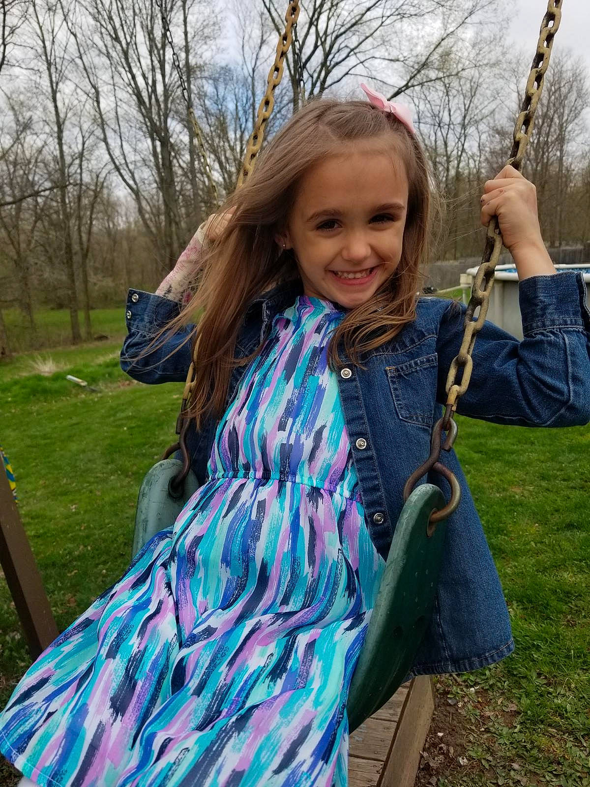 Abigail joined the competition — help win amazing prizes! blue, brown_hair, clothing, dress, electric_blue, fashion_accessory, grass, hair, hairstyle, jacket, joy, long_hair, neck, outerwear, pattern, person, plant, scarf, shoulder, spring