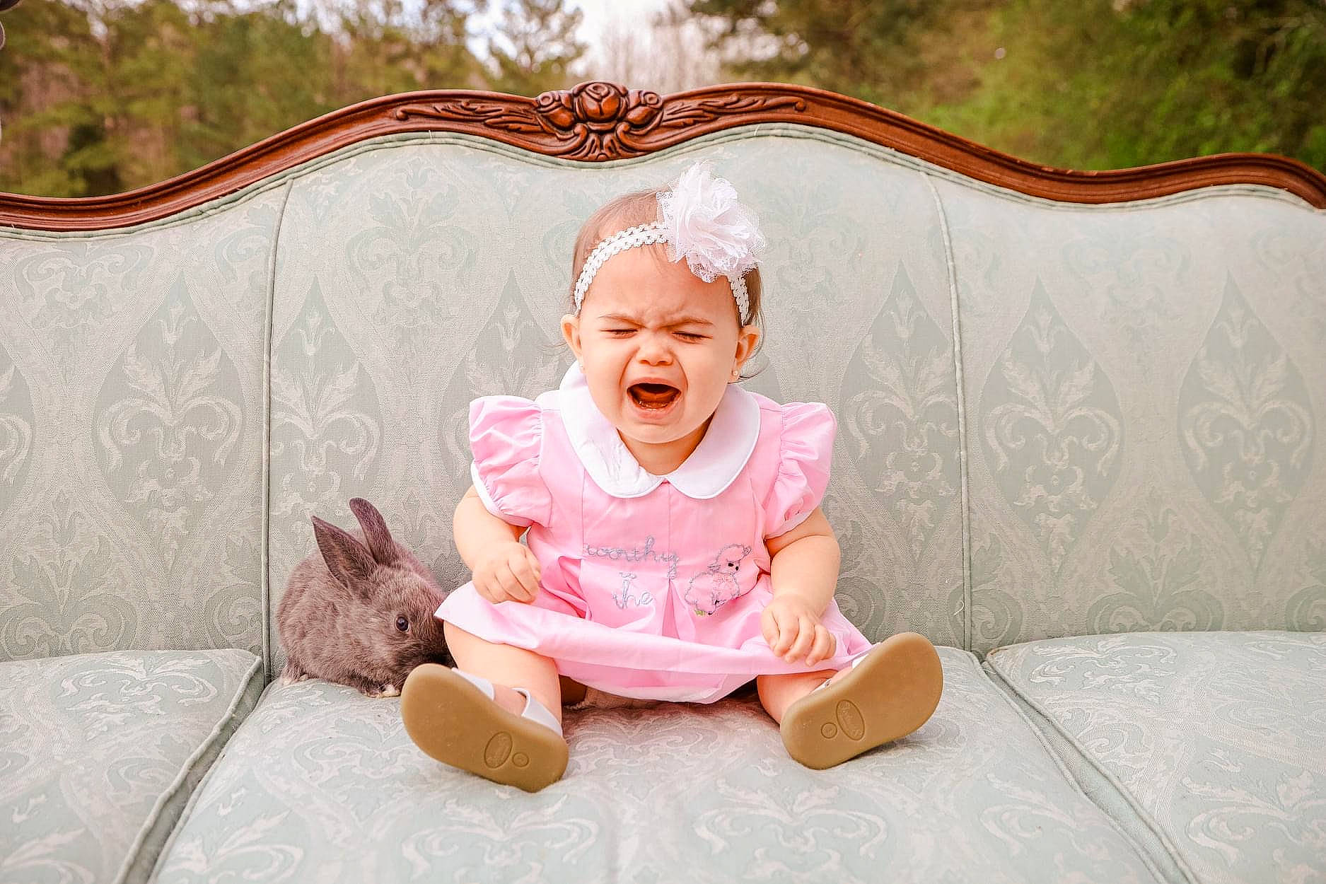 Nora Kate is registered to the contest to win money with this photo: baby_toddler_clothing, cheek, child, comfort, event, flooring, grass, happy, head, headwear, leisure, magenta, pattern, peach, person, pink, room, sitting, smile, toddler