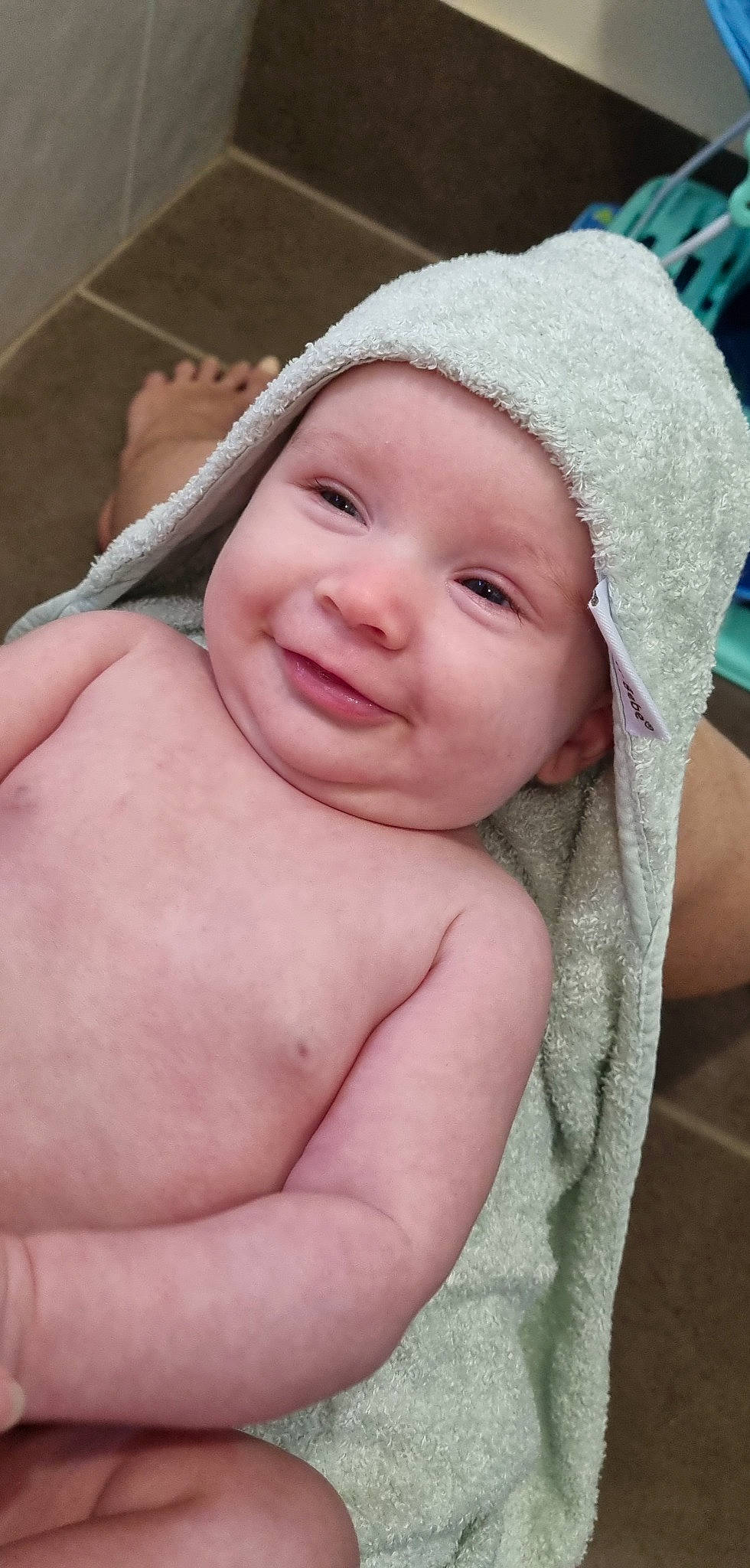 Billie is registered to the contest to win money with this photo: baby, cap, cheek, chest, child, chin, close_up, eyebrow, flesh, fun, happy, headwear, iris, joy, linens, lip, nose, person, pink, portrait_photography