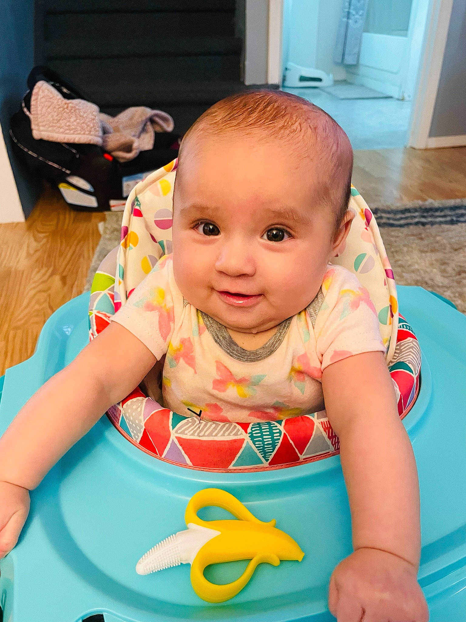 Lilianna is registered to the contest to win money with this photo: arm, baby, baby_playing_with_toys, baby_products, baby_toddler_clothing, baby_toys, cheek, child, door, facial_expression, flooring, fun, happy, hardwood, leisure, person, play, sitting, skin, toddler