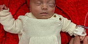 Oaklynn joined the competition — help win amazing prizes! baby, sleeping, infant, red_bow, white_knitwear, blanket, hand, resting, cozy, indoor, cute, peaceful, portrait, child, newborn, soft_texture, tender, clothing, headband, person