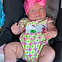 Oaklynn is registered to the contest to win money with this photo: baby, infant, car_seat, pink_bow, colorful_clothing, socks, smile, wink, cute, child, seatbelt, plush, legs, hand, headband, cheeks, indoors, safety, comfort, happy