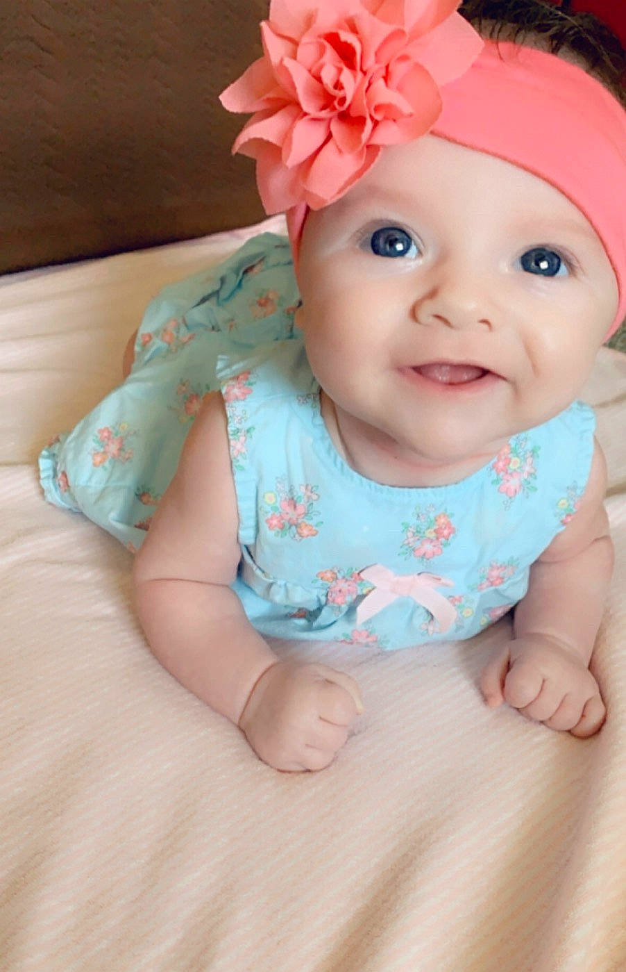 Elora is registered to the contest to win money with this photo: baby, baby_bloomers, baby_products, baby_toddler_clothing, cheek, child, face, fashion_accessory, hair_accessory, head, headband, headgear, headwear, pattern, person, pink, product, skin, smile, toddler