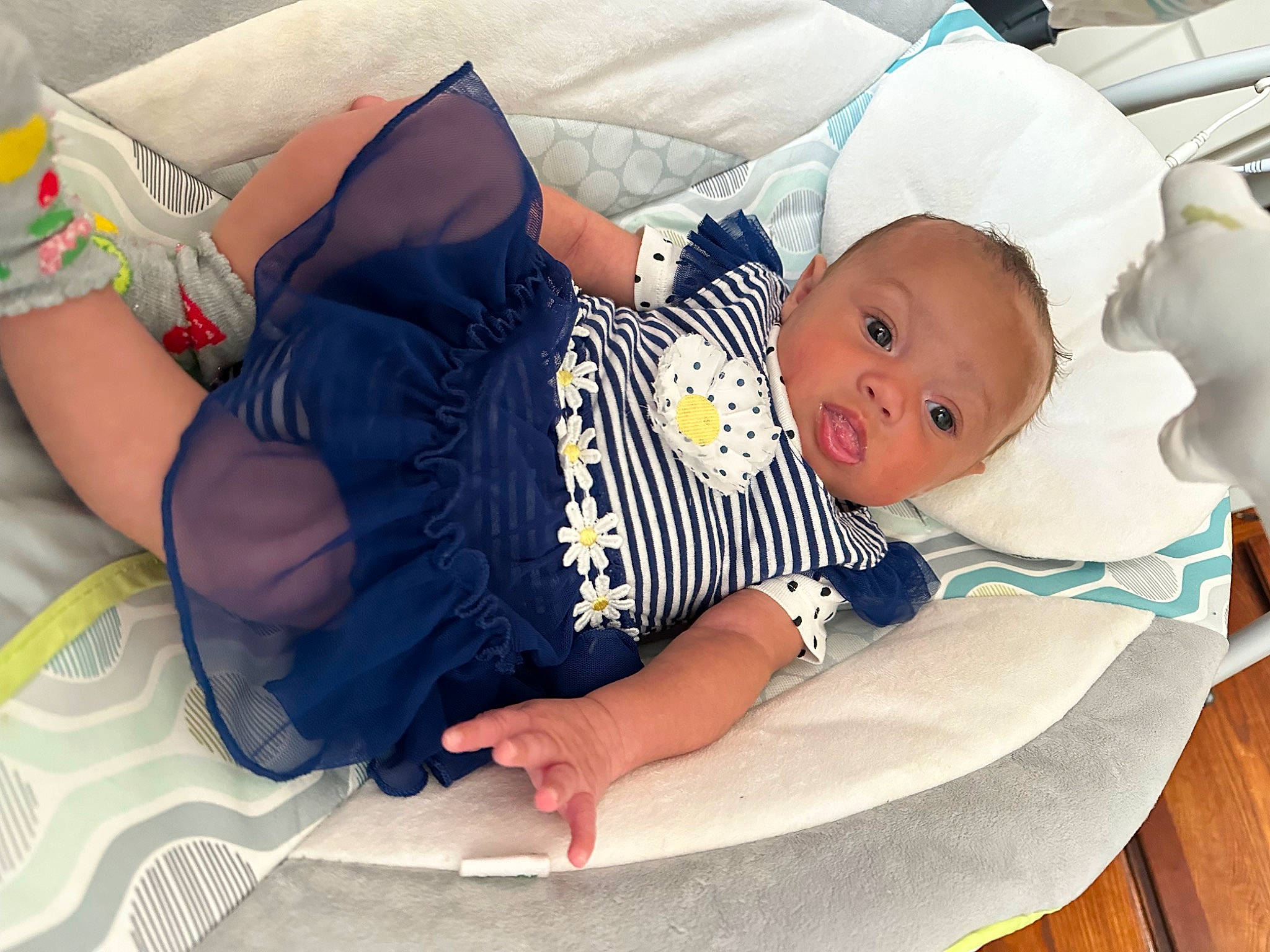Malani Turley is registered to the contest to win money with this photo: baby, baby_products, baby_safety, baby_sleeping, baby_toddler_clothing, child, comfort, hat, lap, linens, pattern, person, room, sitting, sock, t_shirt, thigh, toddler