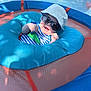 Zaiden joined the competition — help win amazing prizes! baby, sunglasses, hat, pool_float, blue, water, smile, child, summer, outdoor, sunlight, infant, fun, relaxation, cute, playful, floating, clothing, cheerful, vacation