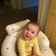 Coraline is registered to the contest to win money with this photo: architecture, baby, babylaughing, bathing, chair, couch, crib, cushion, door, face, furniture, happy, head, homedecor, infantbed, person, photography, portrait, sitting, smile