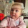 Coraline is registered to the contest to win money with this photo: appliance, baby, bodypart, bowl, chair, cup, device, electricaldevice, face, finger, furniture, hand, head, indoors, mixingbowl, person, photography, portrait, refrigerator, shelf