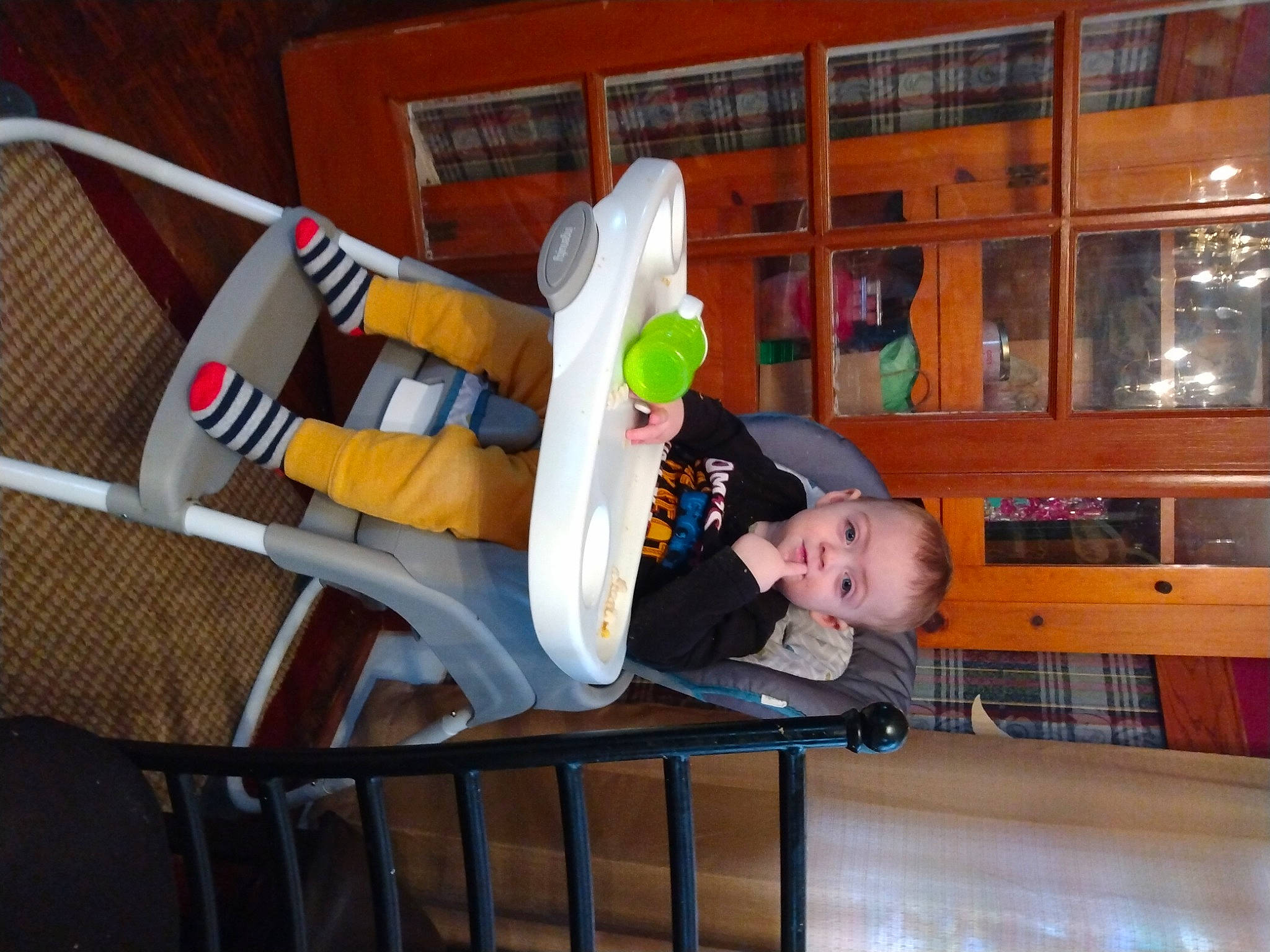 Bucky joined the competition — help win amazing prizes! baby, baby_products, baby_safety, baby_toddler_clothing, chair, child, comfort, fun, hardwood, leisure, person, play, room, sitting, smile, sock, toddler, wood