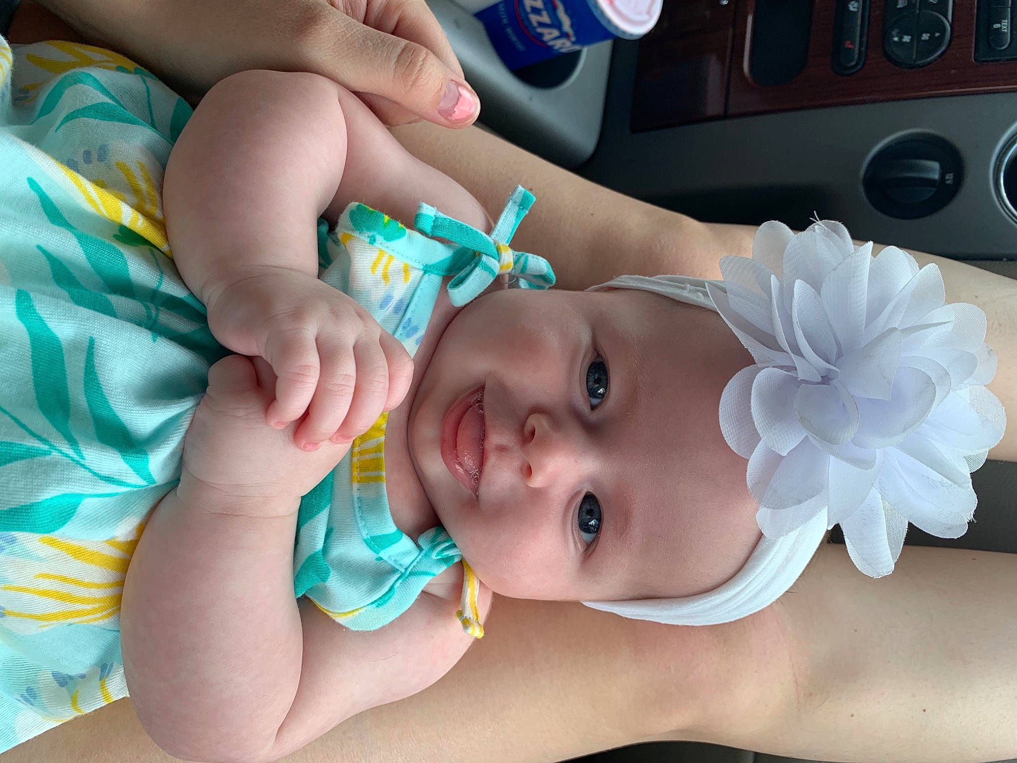 Emmalynn is registered to the contest to win money with this photo: azure, baby, baby_toddler_clothing, beauty, blue, cheek, child, eyelash, fashion_accessory, finger, fun, hand, happy, headgear, headpiece, headwear, mouth, nail, person, product