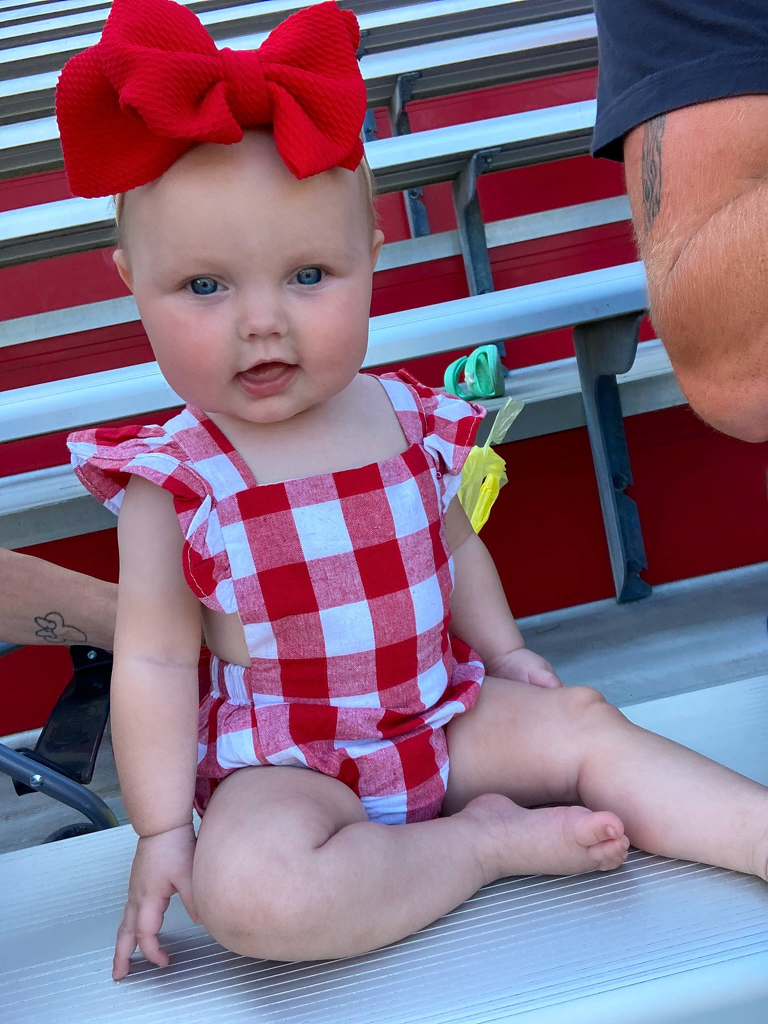 Mazelynn is registered to the contest to win money with this photo: baby, baby_toddler_clothing, costume_hat, face, finger, fun, hand, happy, hat, head, headwear, lap, leg, pattern, person, pink, red, skin, sleeve, thigh