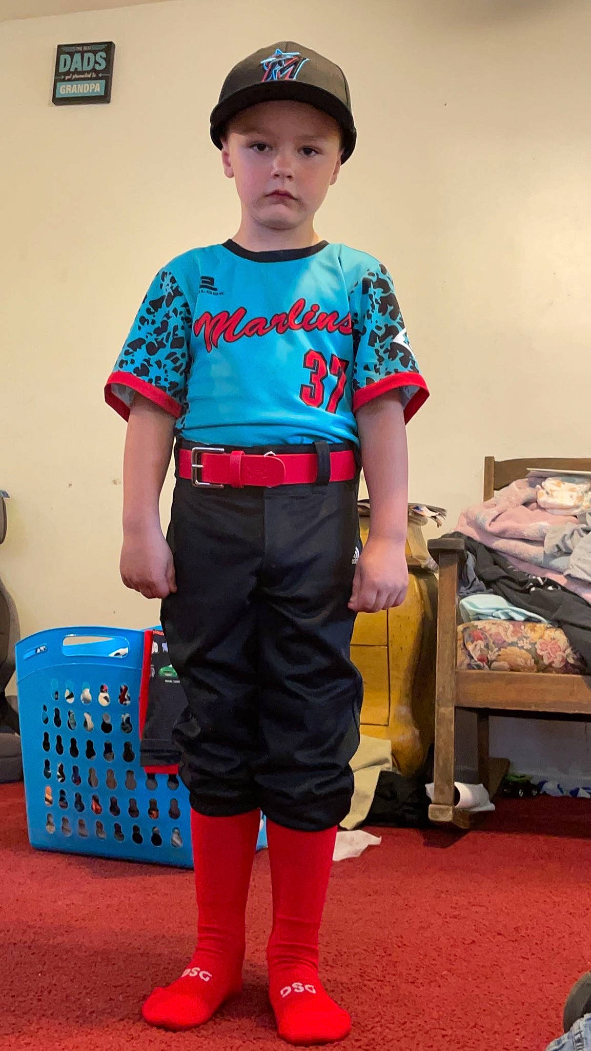 Daxton is registered to the contest to win money with this photo: bag, belt, child, electric_blue, event, fashion, fashion_design, headwear, joint, knee, luggage_and_bags, neck, pattern, people, person, shoulder, sleeve, sportswear, standing, t_shirt