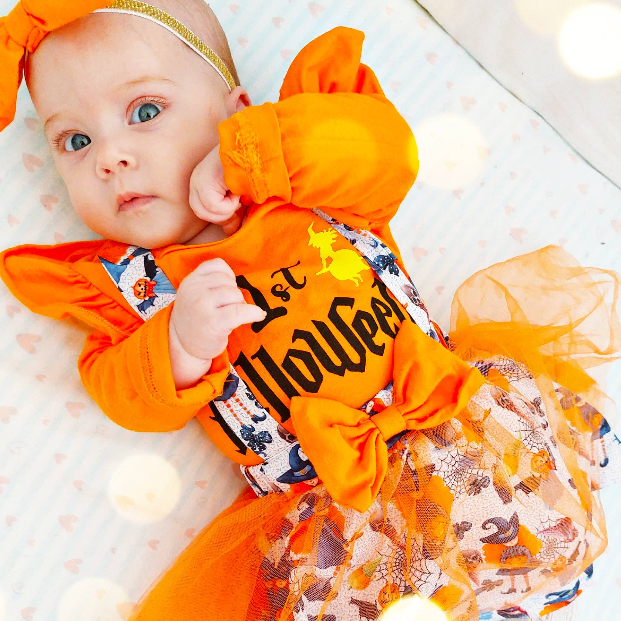 Ava participe au concours pour gagner de l'argent avec cette photo : arm, baby, baby_products, baby_sleeping, baby_toddler_clothing, beanie, child, comfort, font, happy, orange, pattern, peach, person, play, sitting, sleeve, sportswear, t_shirt, textile