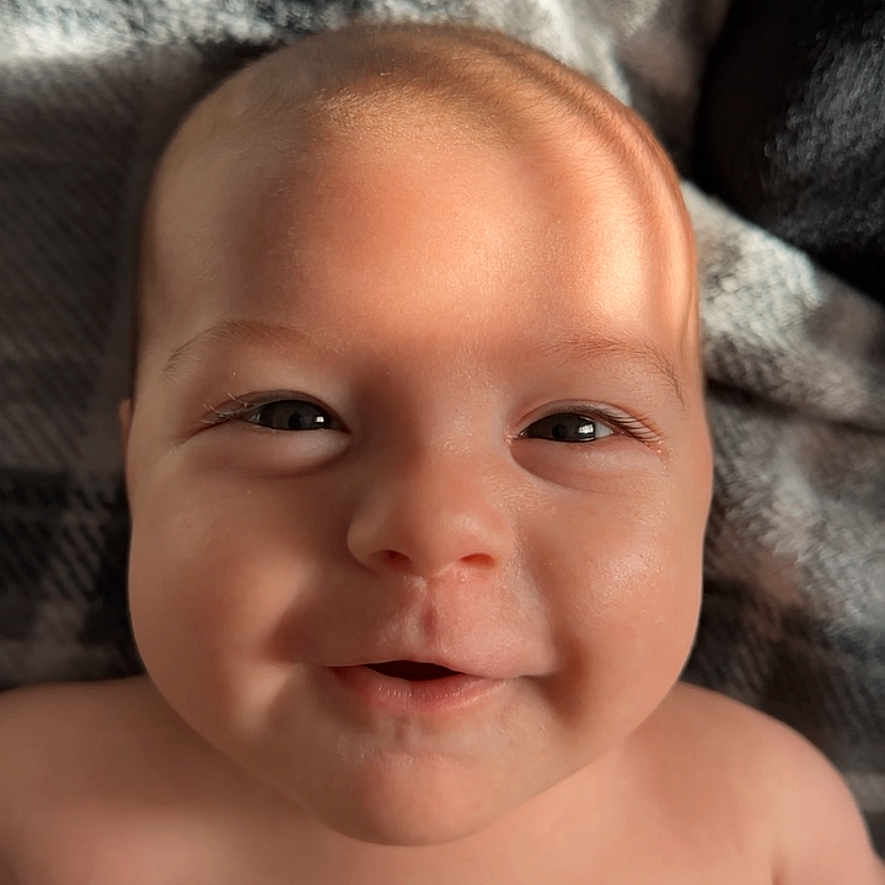 Mateo is registered to the contest to win money with this photo: baby, bodypart, face, finger, hand, happy, head, mouth, newborn, person, photography, portrait, smile