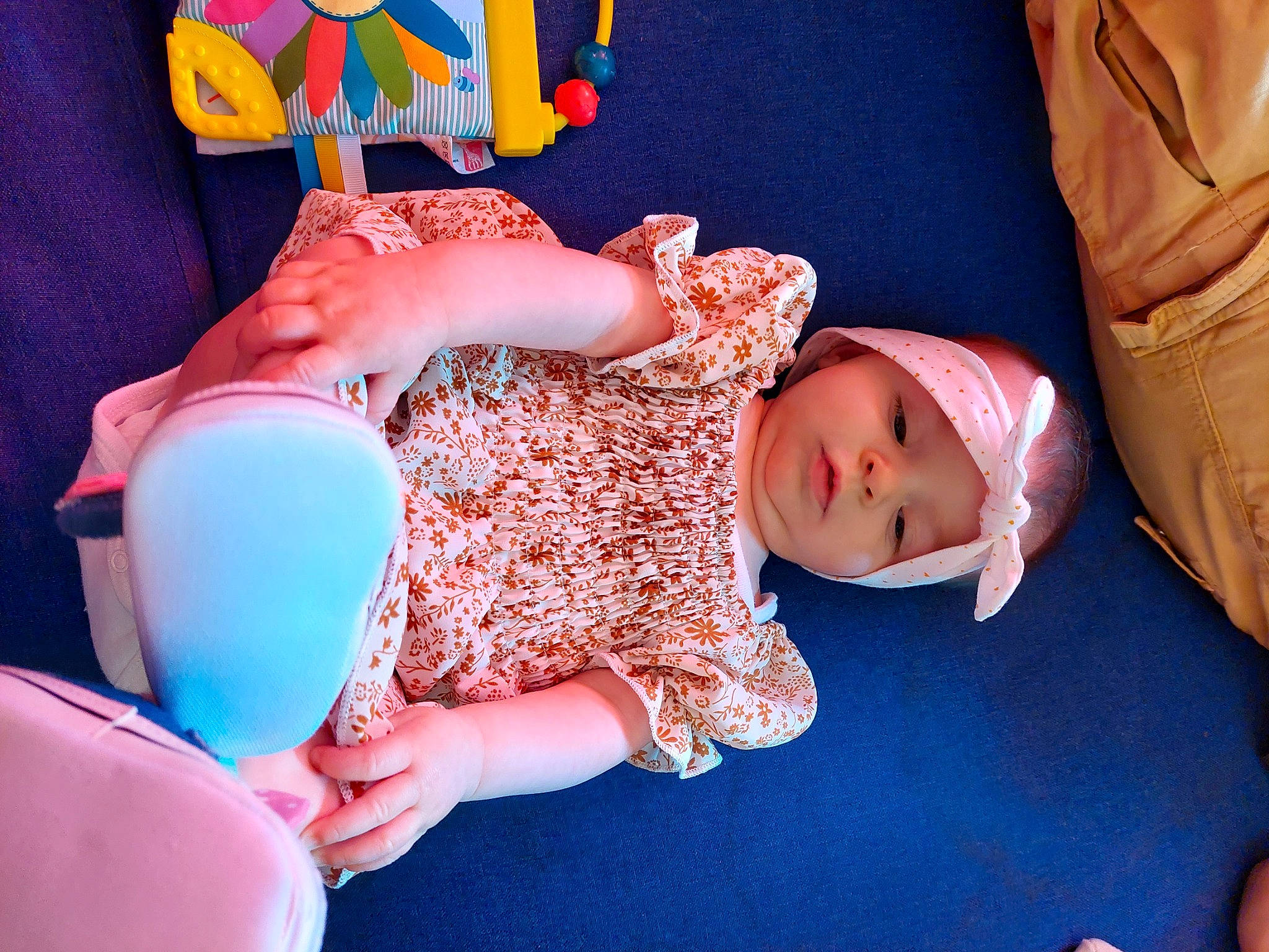 Syanna participe au concours pour gagner de l'argent avec cette photo : azure, baby, baby_toddler_clothing, blue, comfort, facial_expression, finger, fun, hand, headwear, human_body, joint, leg, orange, person, pink, product, purple, skin, tableware