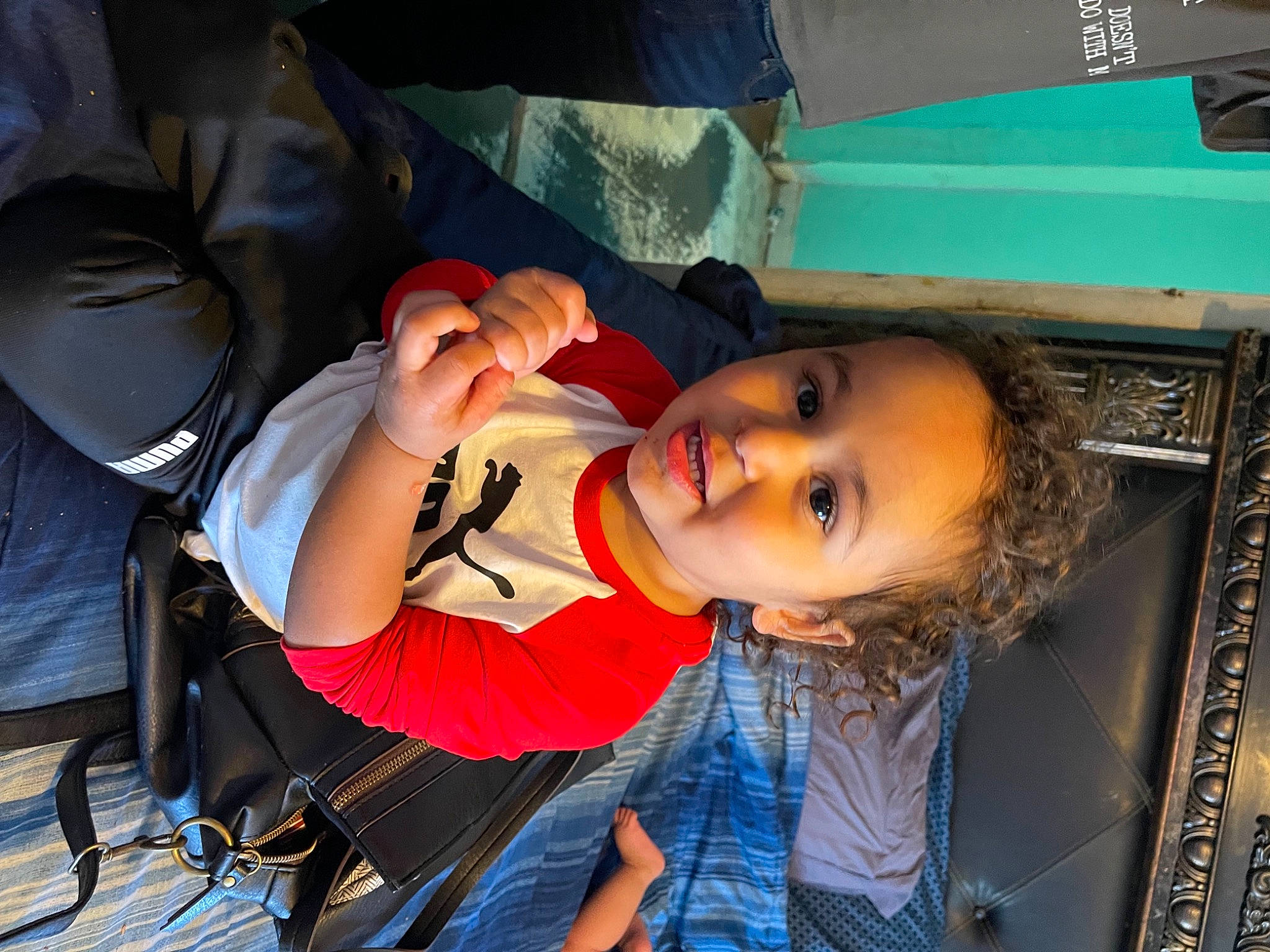 Jay David  joined the competition — help win amazing prizes! black_hair, child, chin, comfort, denim, elbow, eyelash, fun, leisure, mouth, person, sitting, skin, smile, toddler, trunk, vacation
