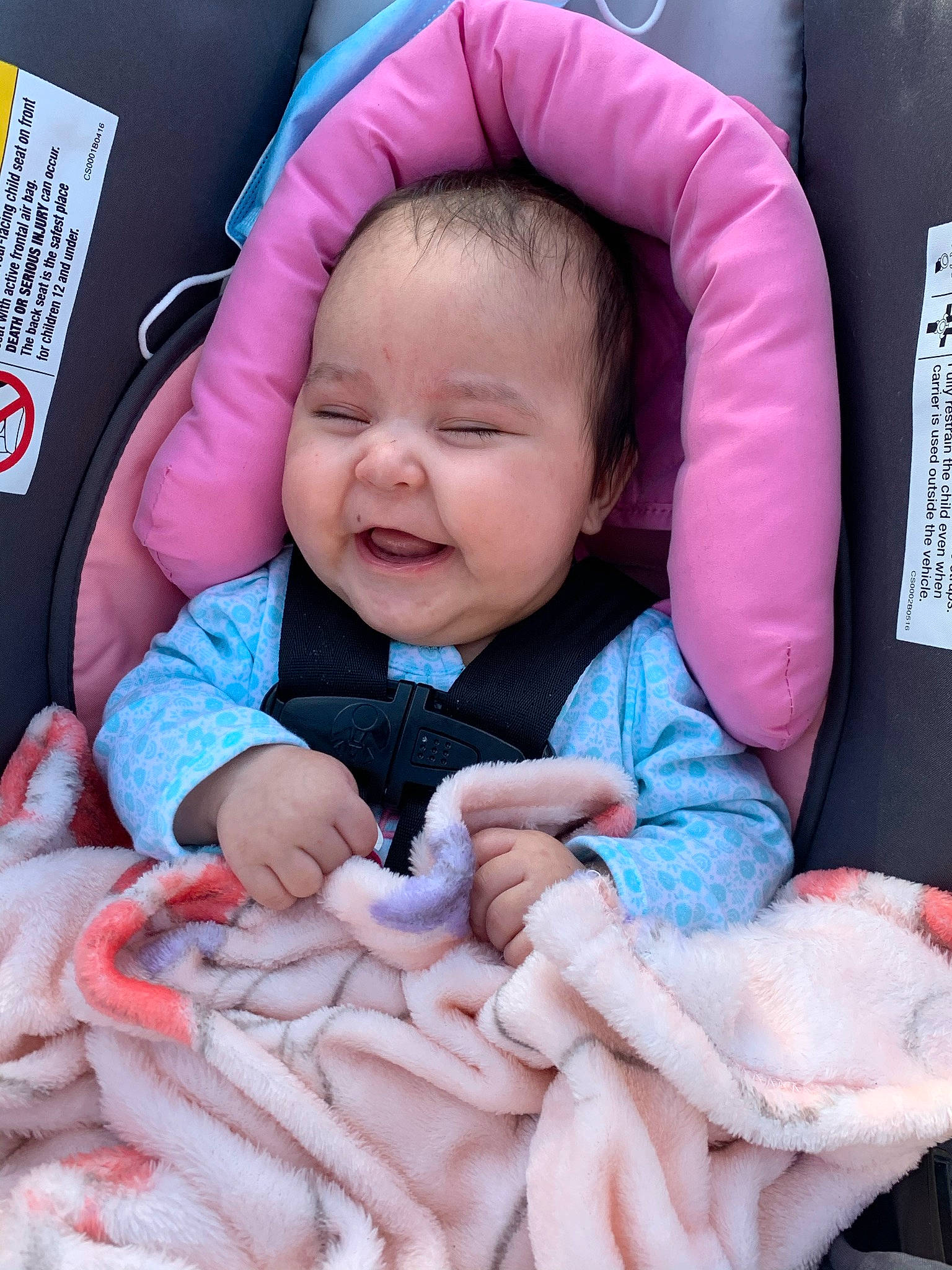 Jaylani is registered to the contest to win money with this photo: baby, baby_in_car_seat, baby_toddler_clothing, cheek, comfort, face, finger, gesture, happy, head, human, mouth, person, pink, product, skin, smile, textile, thumb, toddler