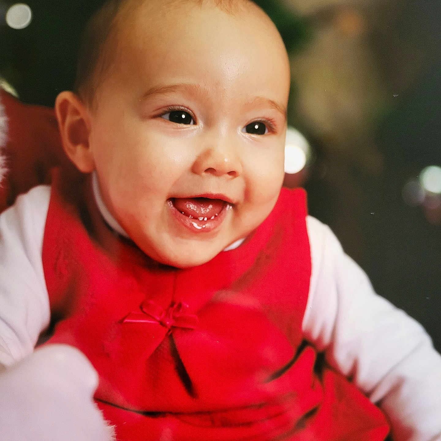 Cassandra participe au concours pour gagner de l'argent avec cette photo : baby, bokeh, cheerful, child, closeup, cute, cute_expression, face, festive, glowing_skin, happy, holiday, indoors, infant, joyful, portrait, red_dress, smiling, toddler, young