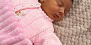 Everlie joined the competition — help win amazing prizes! newborn, baby, sleeping, pink_clothing, knitted, blanket, soft_texture, infant, peaceful, cozy, cute, child, portrait, resting, warmth, hand, face, lying_down, fabric, closeup
