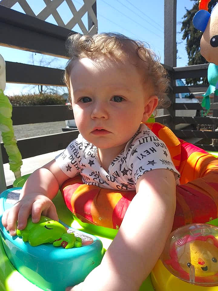 Ryder James is registered to the contest to win money with this photo: baby, baby_products, baby_toddler_clothing, blue, cheek, child, event, fun, grass, hairstyle, happy, leisure, mouth, person, play, recreation, sitting, sky, summer, tableware